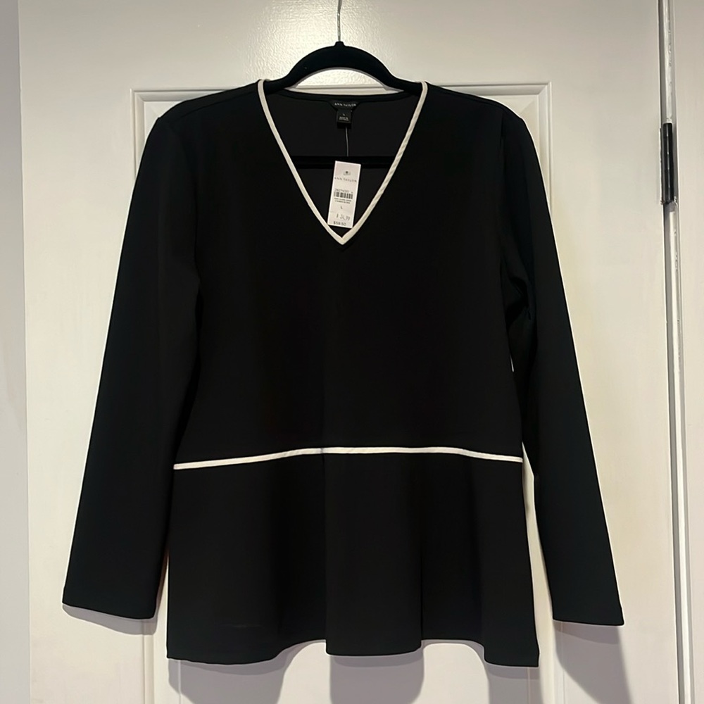 Ann Taylor black V-neck peplum top with white trim. New size L.